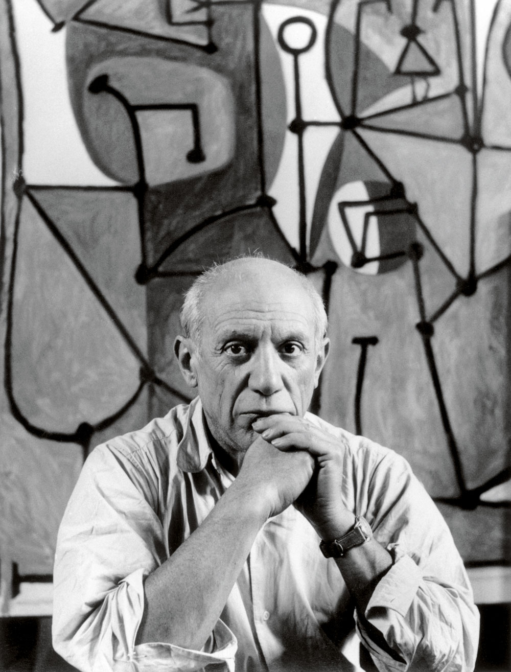 Pablo Picasso in front of <i>The Kitchen</i> (<i>La cuisine</i>, 1948) in his rue des Grands-Augustins studio, Paris, 1948